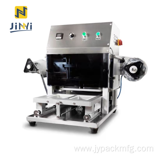Automatic pneumatic sealing machine for ready meal